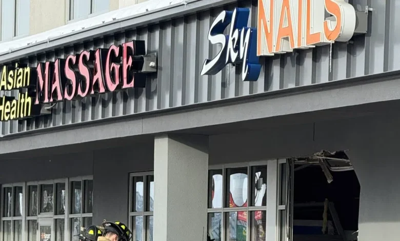 Vehicle drives through front of south Fargo business