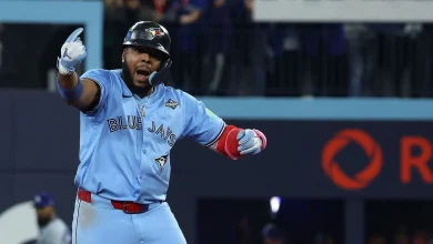 Vladimir Guerrero Jr. wears "Captain Clutch" Poulin jersey to World Series Game 7