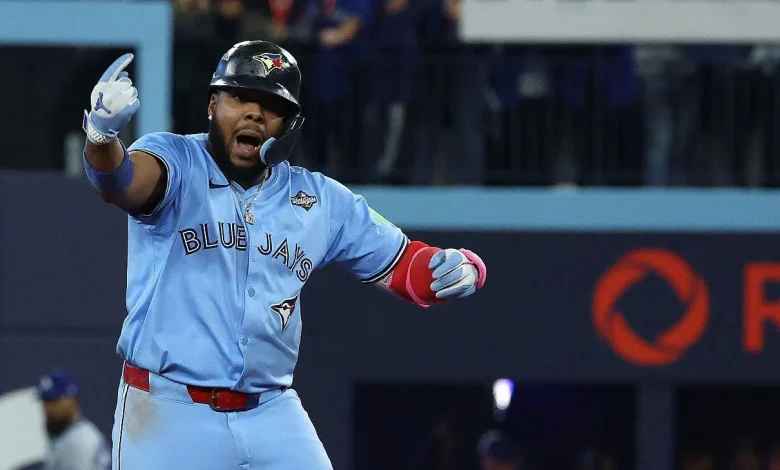 Vladimir Guerrero Jr. wears "Captain Clutch" Poulin jersey to World Series Game 7