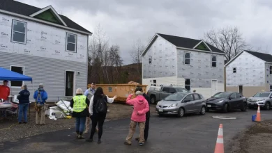 Volunteers fend off rain to help Central Berkshire Habitat for Humanity's Carter build day