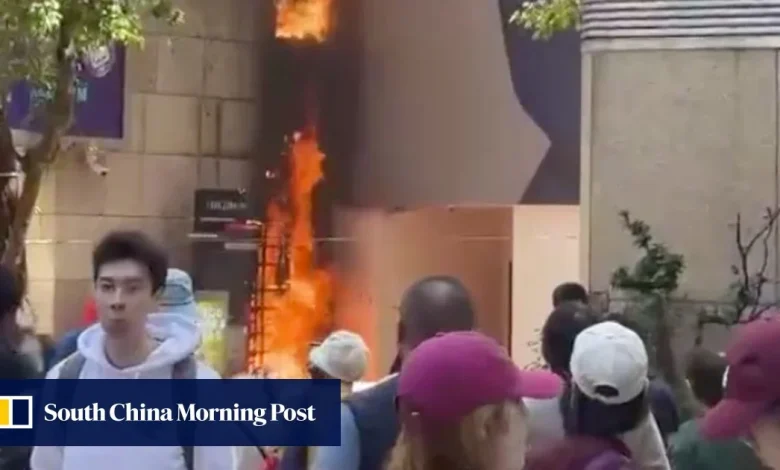 Wall of Hong Kong’s Lee Theatre Plaza catches fire at lunchtime