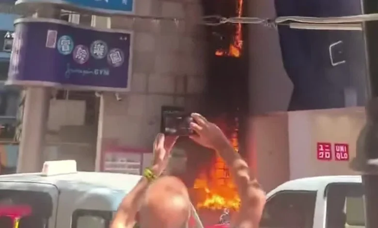 Watch This | Artificial grass wall at Causeway Bay's Lee Theatre engulfed in flames: Cigarette butt suspected