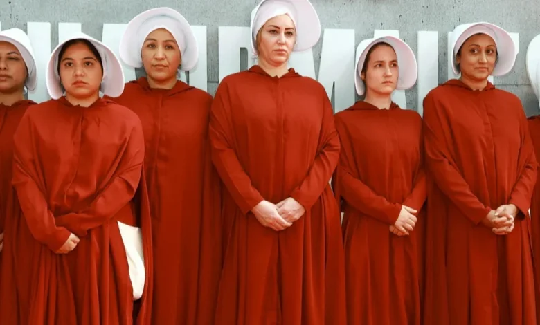 What inspired the outfits in Margaret Atwood's "The Handmaid's Tale"
