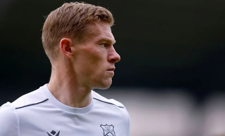 Wrexham's McClean says he threw punch at fan