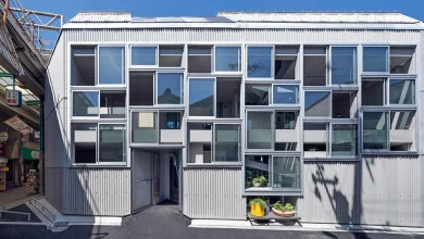 grid of operable windows fronts slender residence by okuwada architects in osaka