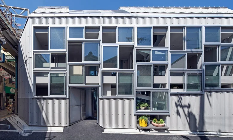 grid of operable windows fronts slender residence by okuwada architects in osaka