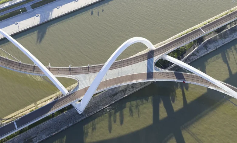 zaha hadid architects draws from silk embroidery of hangzhou with serpentine footbridge