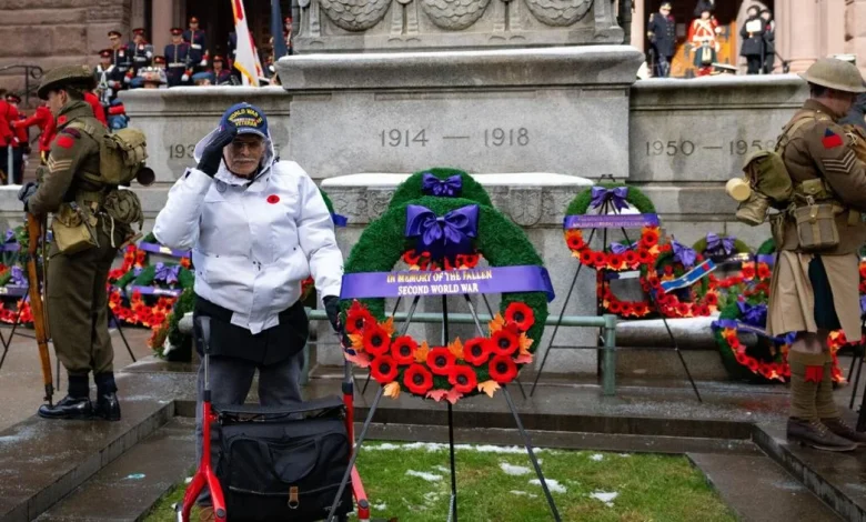 ‘We hold high the torch they threw us’: Remembrance Day ceremony at Old City Hall honours the fallen