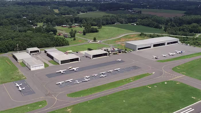 A business jet crashed while landing at an airport in North Carolina, erupting in a large fire