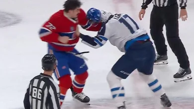 Arber Xhekaj drops Adam Lowry in a heated centre-ice fight