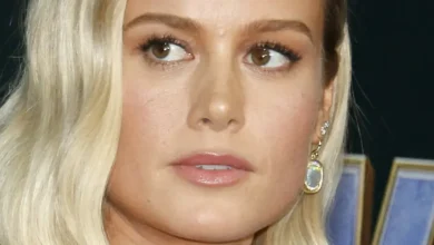 Brie Larson Highlights 'The Best Pair' In Braless Glitter Dress