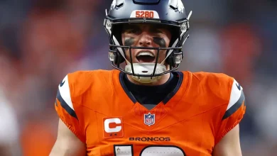 Broncos clinch NFL playoffs with 34-26 win over Packers