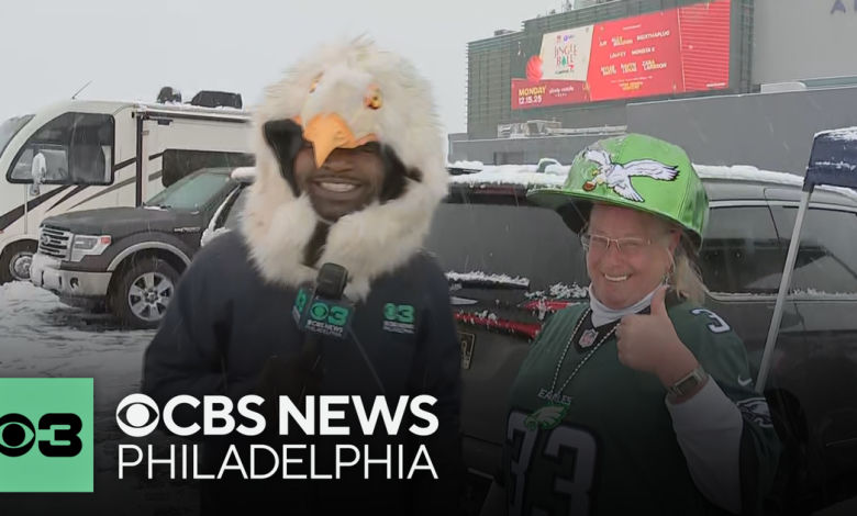 Eagles fans brave the snow and cold hours before kickoff at Lincoln Financial Field