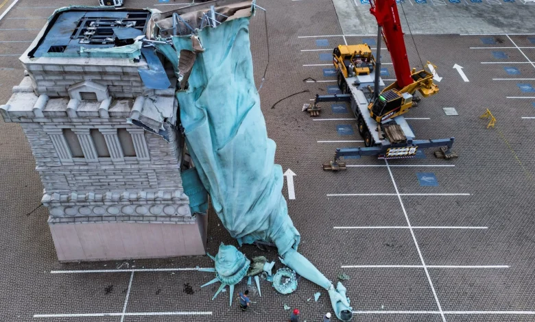 Horror moment massive 78ft ‘Statue of Liberty’ COLLAPSES in brutal 55mph storm sending it crumbling to the ground