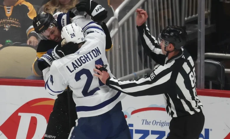 Leafs' Scott Laughton goes after Pens' Evgeni Malkin for attempting to clip him in the head