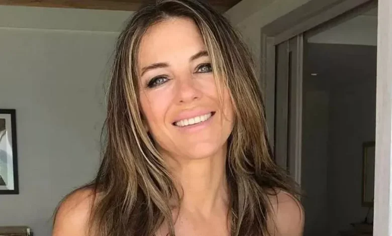Liz Hurley 'looks 25' in teeny string bikini as she flogs her swimwear to fans