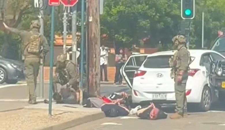 Men pulled from crashed car by heavily armed tactical police