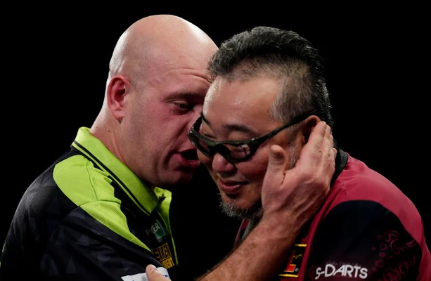 Michael van Gerwen survives scare to reach World Championship second round