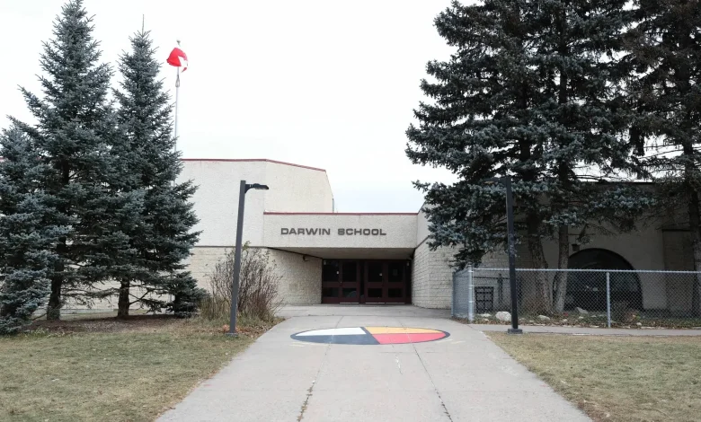 Nervous parents greeted by locked door, guards at site of school assault