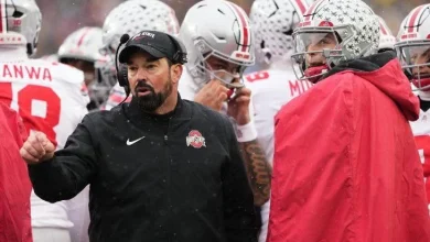 Ohio State head coach Ryan Day, left, speaks with quarterback Julian Sayin during the first half of last Saturday's game against Michigan.