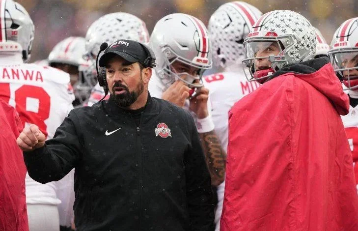 Ohio State head coach Ryan Day, left, speaks with quarterback Julian Sayin during the first half of last Saturday's game against Michigan.