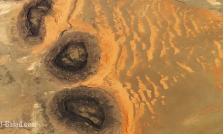 Rare Sahara Sand Dunes Emerge from Paleozoic ‘Black Mesas’ Seen from Space
