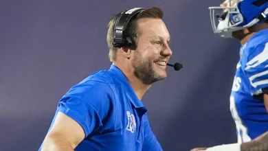 Razorbacks hire Larry Smith to lead wide receivers group of new offense