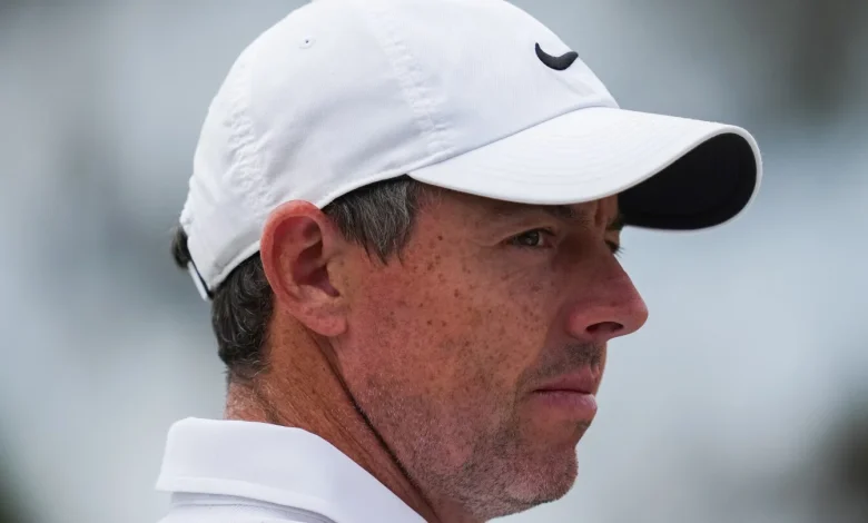 Rory McIlroy's late birdie burst means he'll be playing on the weekend at the Australian Open