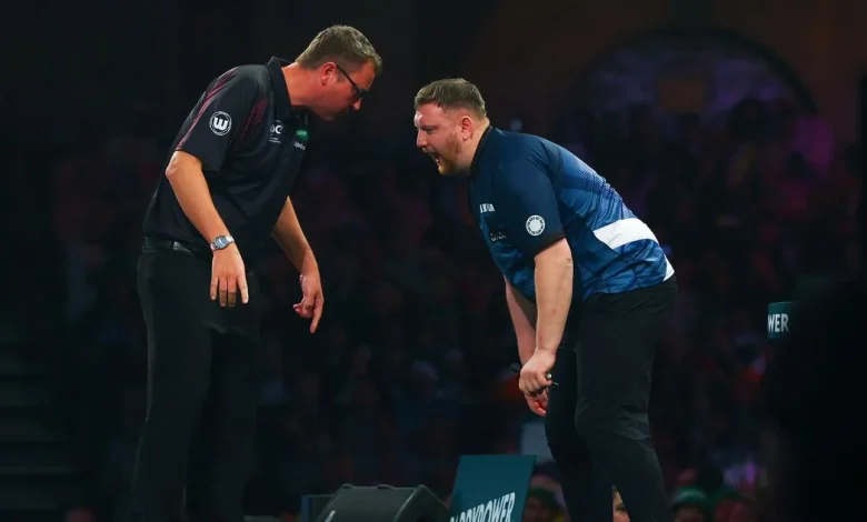 Shocking pics as darts star left bloodied at Ally Pally as he storms off stage for treatment