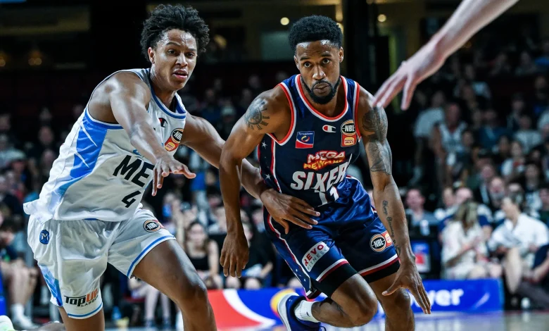 Sixers prevail in OT in clash for top spot