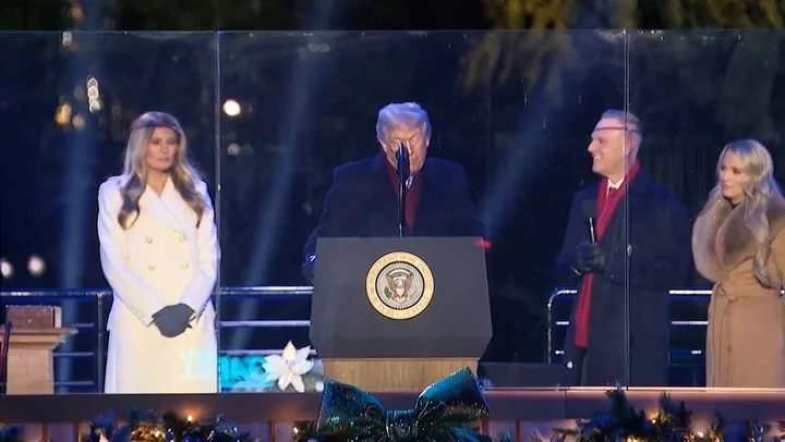 Trump appears to reference his notes as he counts down from five to one: Watch