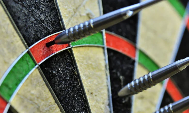 Two-time champion survives scare to reach second round