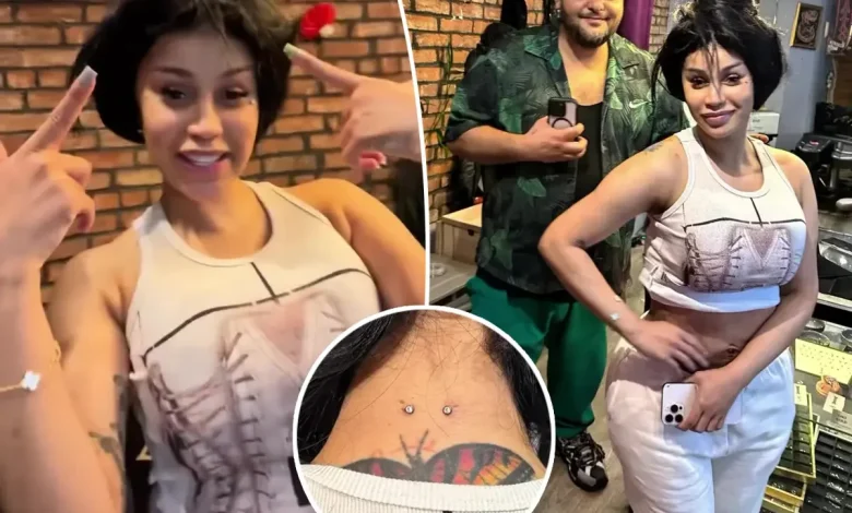 Watch Cardi B get a new set of neck and back piercings