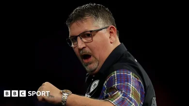 World Darts Championship: Gary Anderson battles back to reach second round with 3-2 win over Adam Hunt