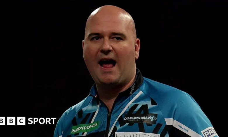 World Darts Championship: Rob Cross and Rob Searle coast into second round on day two