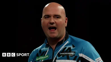 World Darts Championship: Rob Cross and Ryan Searle coast into second round on day two
